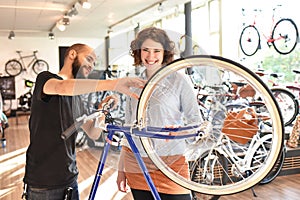 Customer and dealer in bicycle shop - purchase and repair of bicycles - customer service