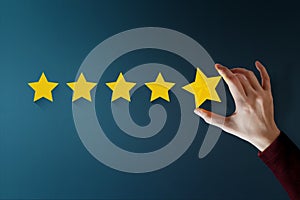 Customer Experience Concept, Best Excellent Services for Satisfaction present by Hand of Client giving a Five Star Rating