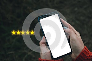 Customer Experience Concept. Digital phone user give five stars in his review and feedback