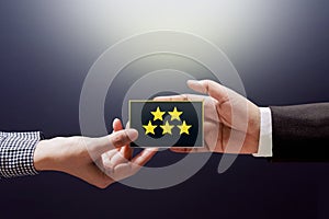 Customer Experience Concept, Happy Client Woman giving a Feedback with Five Star Rating on Card into a Hand of Businessman