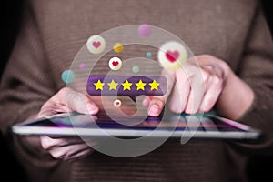 Customer Experiences Concept. Closeup of  Woman Using Digital Tablet to Giving Feedback via the Internet. Positive Review. Client