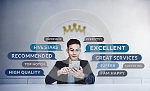 Customer Experiences Concept. a Young Happy Man Reading Positive Review Rating via Smartphone. Client`s Satisfaction Surveys photo