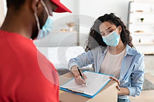 Customer In Face Mask Receiving Order Signing Paper Form