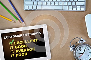 Customer feedback excellent good average and poor on computer digital tablet on desk