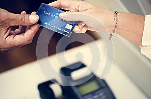 Customer handing credit card for payment