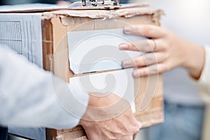 Customer hands, courier cardboard box and delivery man giving retail sales product, shopping or shipping container