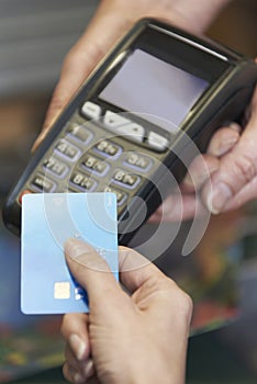 Customer Making Purchase Using Contactless Payment photo