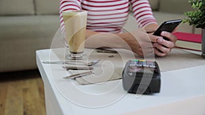 Customer making wireless or contactless payment using smartphone, nfc payment