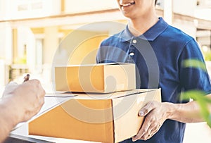 Customer Man signature in clipboard to receive package from professional delivery man at home