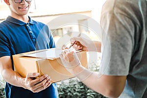 Customer Man signature in clipboard to receive package from professional delivery man at home