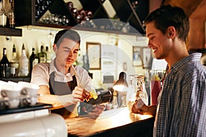 Customer Paying With Credit Card In Cafe