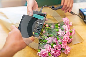 Customer paying in flower shop