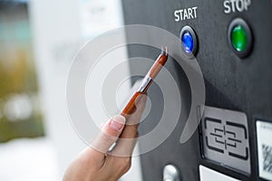 Customer paying with NFC technology on parking system