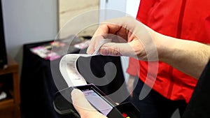 Customer paying with a wi-fi debit and credit card machine