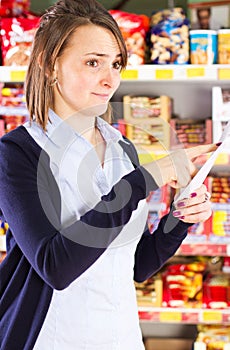 Customer pointing at shopping list