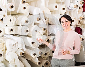 Customer posing near cloth winds