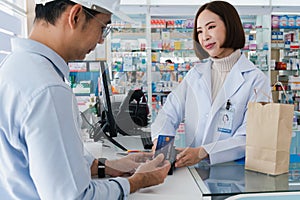 Customer purchases qualified prescription medical drugs from pharmacist.