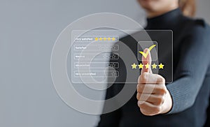 Customer review rating and satisfaction survey concept. Customer give thumbs up to the checkbox and give it five-star satisfaction