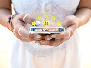 Customer review, satisfaction, feedback concepts. The user give 5 stars point rating and happy smile face.