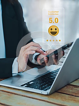 Customer review, satisfaction, feedback, survey concepts. The User giving 5 stars rating with smile face icon.