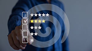 Customer review satisfaction feedback survey. User giving rating to product and service online. 4 stars.