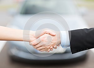 Customer and salesman shaking hands