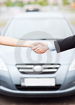 Customer and salesman shaking hands