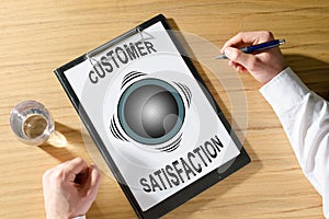 Customer satisfaction concept on a desk