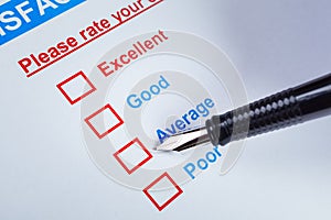 Customer satisfaction survey checkbox with rating and pen pointing at Average, can use any business concept background