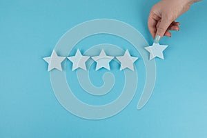 Customer satisfaction survey, Evaluating excellent services rating concepts. The client`s hand picked the five star symbol