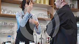 Customer senior woman angry and complain barista woman while frustrated of ordering and service in the cafe.