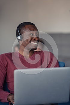 Customer Service agent in an startup office with laptop