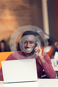 Customer Service agent in an startup office with laptop