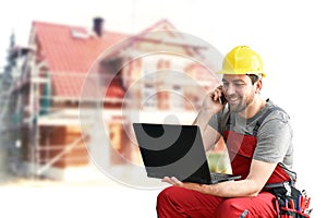 Customer service com craftsmen - workers with telephone and notebook on the construction site