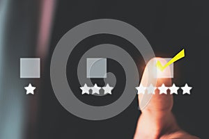 Customer service evaluation satisfaction feedback survey concept,businessman using finger giving rating,happy icon 5 stars,smiley