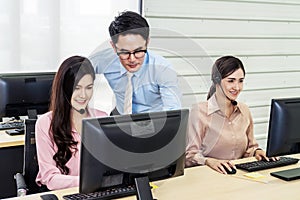 Customer service executive trainer assisting her team at office, Business Team Discussion Team Customer Service Concept