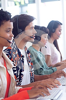 Customer service executives working on computer at desk