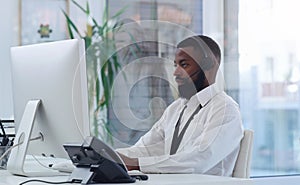 Customer service, headset and black man with computer in office for online crm consultation. Technology, telemarketing