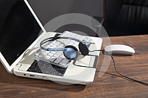 Customer service headset on the computer keyboard