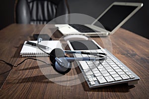 Customer service headset, computer keyboard and business objects