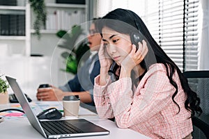 Customer service operator with headsets working at call centre