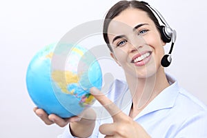 Customer service operator woman with headset smiling, globe