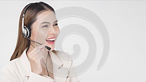 Customer service operator woman in suit wearing headset over white background studio