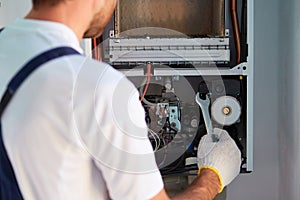 Customer service for the repair and adjustment of the gas boiler. Gas heater maintenance, automation adjustment