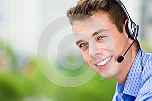 Customer service representative or call center agent or support or operator with headset on outside balcony