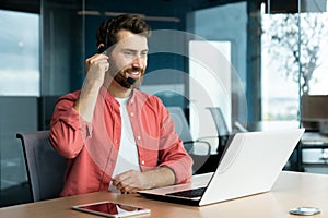 Customer service representative with headset phone consults customer buyer, joyful man uses laptop for video call