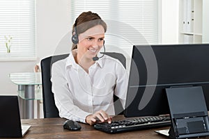 Customer Service Representative Working On Computer