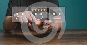 Customer service and Satisfaction concept ,Business people are touching the virtual screen on the happy Smiling face icon.