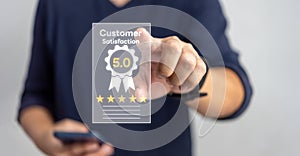 Customer service satisfaction evaluation concept. Man touching virtual screen with gold five star rating excellent feedback icon,