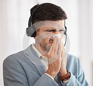 Customer service, sick or man blowing nose in call center office with hay fever sneezing or illness. Cold, contact us or